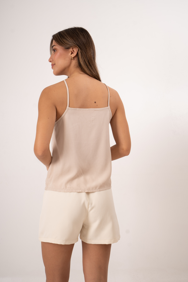 Musculosa de broderie evasé con escote en "V"