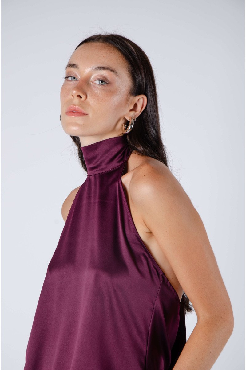 Blusa de satén evasé escote halter con lazo, espalda baja y terminación asimétrica