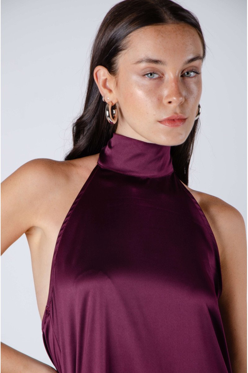Blusa de satén evasé escote halter con lazo, espalda baja y terminación asimétrica
